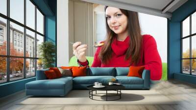 brunette woman having dinner Wall mural