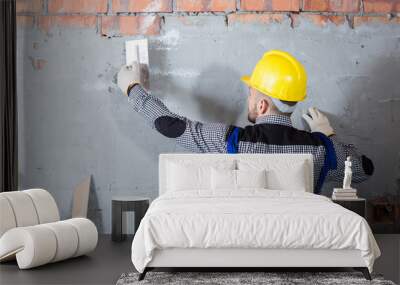 Builder is plastering the wall Wall mural