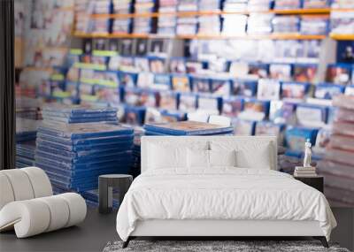 cds and dvds on piles at store Wall mural