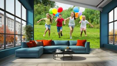 Children running with colorful balloons Wall mural