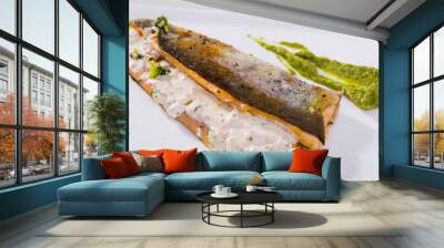 Dish of tasty steak of fried river trout fillet with sause tartar on plate Wall mural