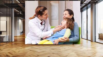 doctor looks mouth of baby Wall mural