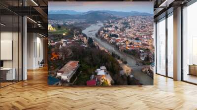 Evening drone view of the ancient city of Kutaisi, located on the two banks of the Rioni River and a center of culture, Georgia Wall mural