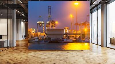 Evening view of   cranes and containers in seaport Wall mural