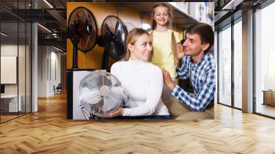 Family buying fan blower Wall mural