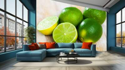 Fresh limes with chopped slices Wall mural