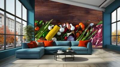 Fresh vegetables, greens and raw beef meat on wooden background, with copyspace Wall mural