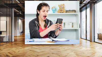 Girl using phone Wall mural