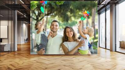 Happy family of four walking with children Wall mural