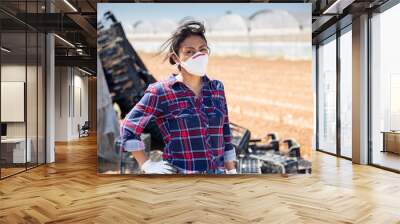 Hispanic female farmer in medical face mask Wall mural