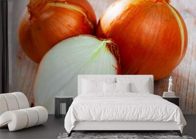 Image of cut onion bulbs on wooden background, nobody Wall mural