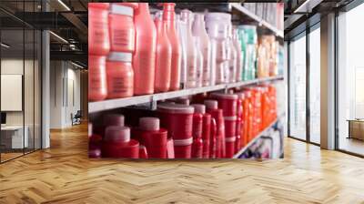 Picture of showcase with bottles of shampoos and conditioners Wall mural