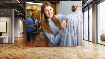 Portrait of female laundry customer Wall mural