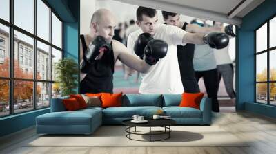 Portrait of men training at sparring together Wall mural