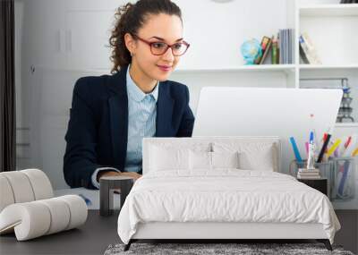 Portrait of successful businesswoman in office. Wall mural