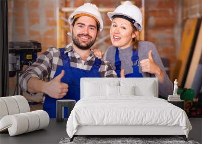 Portrait of two successful workers in uniform inside brick cottage. High quality photo Wall mural