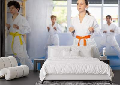 Preteen children during karate training. Martial arts. Active lifestyle concept Wall mural