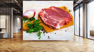 Raw meat, two fresh pork cutlets on wooden cutting board Wall mural