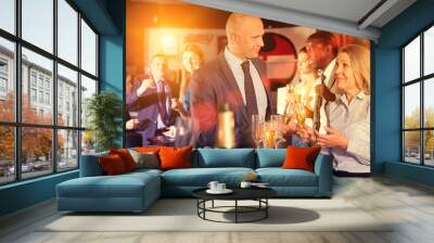 Smiling man and woman drinking alcohol and having conversation on corporate party Wall mural