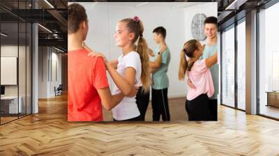 Teenage boys and girls training slow foxtrot Wall mural