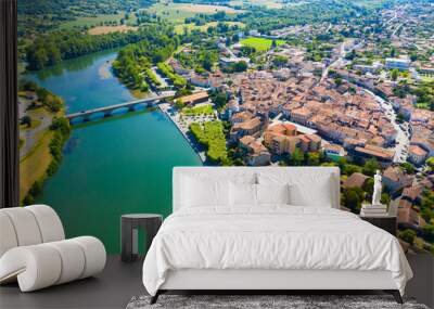 View from drone of cityscape of small French town of Cazeres on river Garonne in summer Wall mural