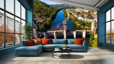 View from drone of medieval fortified arched Pont du Diable or Valentre bridge on river Lot in French town of Cahors in summer Wall mural