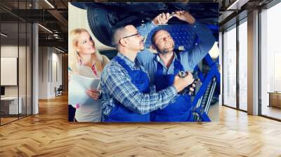 Woman and two auto mechanics Wall mural