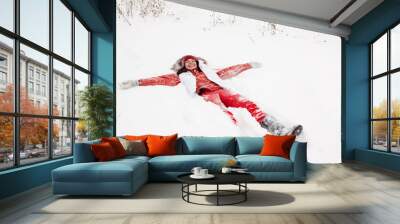 woman lying on  snow Wall mural