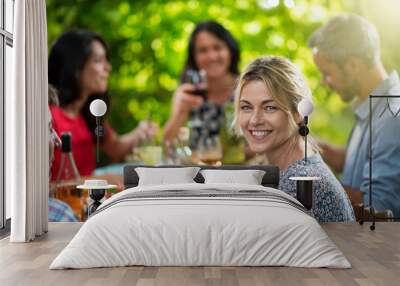 beautiful woman lunching with friends on a terrace table Wall mural