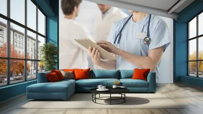 female doctor using digital tablet at hospital Wall mural