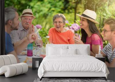 Lunch in the garden for multi-generation family Wall mural