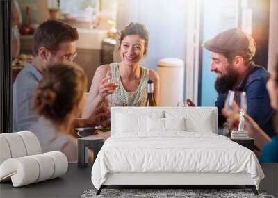 Mixed group of friends having fun while sharing a meal  Wall mural