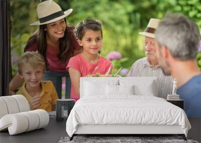 multi-generation family having lunch in the garden Wall mural