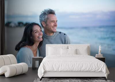 Portrait of a couple walking on the beach Wall mural