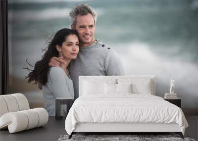 Portrait of a couple walking on the beach Wall mural