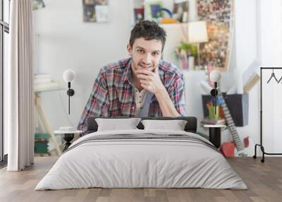 portrait of an handsome young man in his flat Wall mural