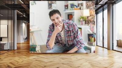 portrait of an handsome young man in his flat Wall mural