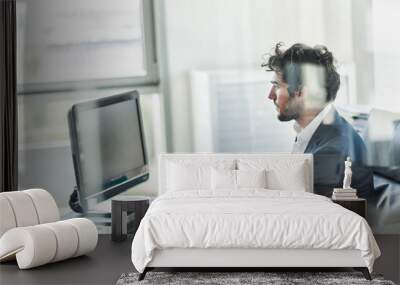 side view of a business partner sitting at his tidy glass desk Wall mural