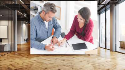 top view of a couple of architects working on ideas. a grey hair Wall mural