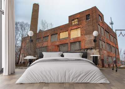 Old red brick abandoned factory industrial building in Detroit Michigan on a cold winter snow day Wall mural