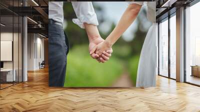 couple holding hands together Wall mural