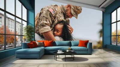 Affectionate military reunion between father and daughter Wall mural