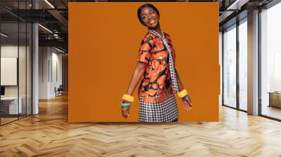 African fashion model on orange background Wall mural