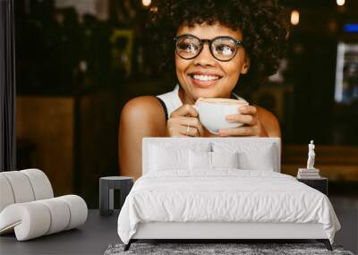 African female relaxing at coffeeshop Wall mural