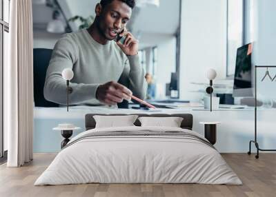 african male architect working in office Wall mural