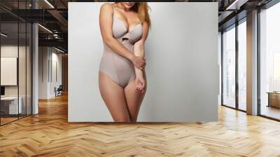 Attractive plus size young lady in body stocking Wall mural