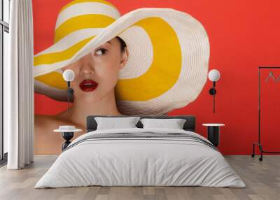 Attractive woman with summer hat Wall mural