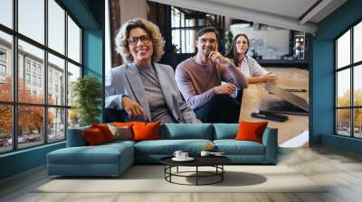 Business colleagues listening to a discussion in a meeting Wall mural