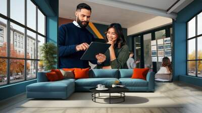 Business colleagues using a digital tablet in a boardroom Wall mural