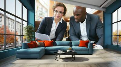 business executives going through papers in lobby Wall mural